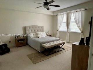 3142 NW 124th Way, Sunrise, FL 33323 - carpeted bedroom featuring baseboards and a ceiling fan
