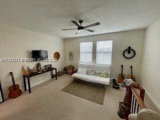 3142 NW 124th Way, Sunrise, FL 33323 - living room featuring a ceiling fan and carpet