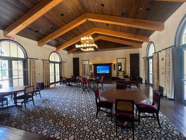 3142 NW 124th Way, Sunrise, FL 33323 - dining room featuring french doors, high vaulted ceiling, hardwood / wood-style floors, healthy amount of natural light, and wooden ceiling with exposed beams