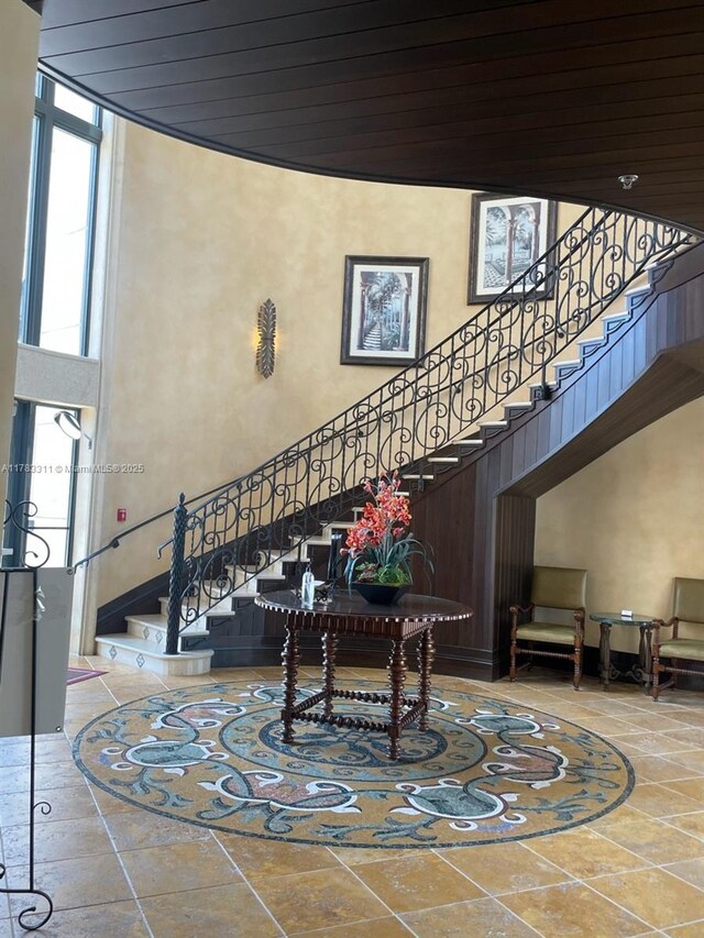 3142 NW 124th Way, Sunrise, FL 33323 - lobby with a towering ceiling, stairs, and wood ceiling