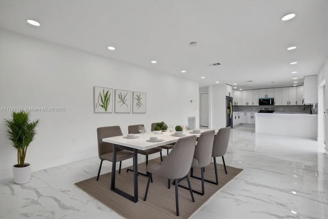 9150 Genesee St, Port Charlotte, FL 33981 - dining room with recessed lighting, visible vents, and marble finish floor