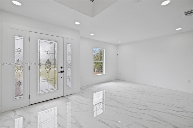 9150 Genesee St, Port Charlotte, FL 33981 - foyer with visible vents, recessed lighting, and marble finish floor