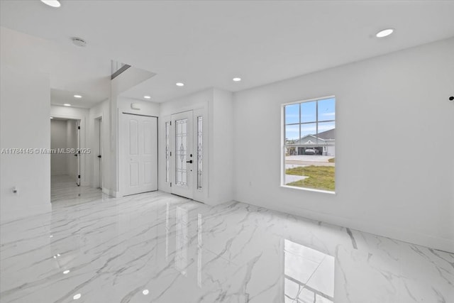 9150 Genesee St, Port Charlotte, FL 33981 - empty room with recessed lighting and marble finish floor