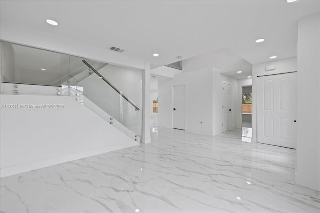 9150 Genesee St, Port Charlotte, FL 33981 - unfurnished living room featuring visible vents, stairway, recessed lighting, marble finish floor, and baseboards