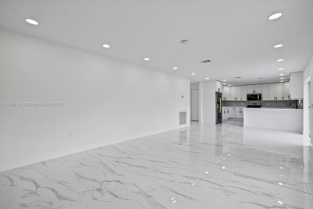 9150 Genesee St, Port Charlotte, FL 33981 - empty room featuring recessed lighting, visible vents, and marble finish floor