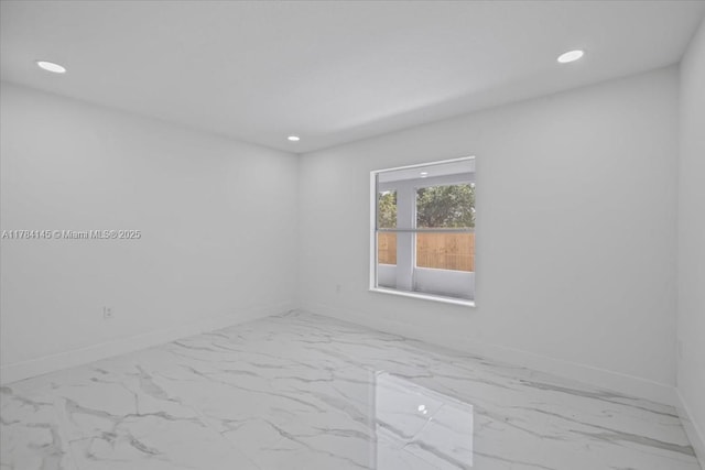 9150 Genesee St, Port Charlotte, FL 33981 - spare room featuring recessed lighting, marble finish floor, and baseboards