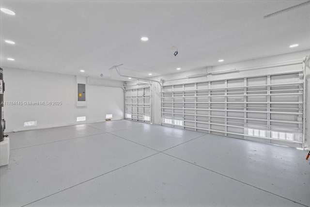 9150 Genesee St, Port Charlotte, FL 33981 - garage featuring electric panel and recessed lighting