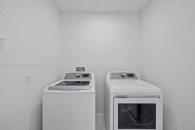 9150 Genesee St, Port Charlotte, FL 33981 - washroom with marble finish floor, washing machine and dryer, and laundry area