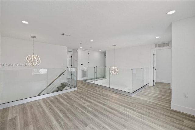 9150 Genesee St, Port Charlotte, FL 33981 - unfurnished room featuring wood finished floors, visible vents, and recessed lighting
