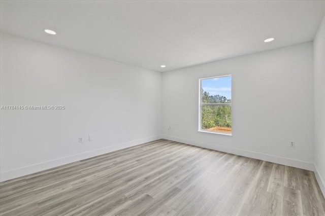 9150 Genesee St, Port Charlotte, FL 33981 - spare room featuring recessed lighting, baseboards, and wood finished floors