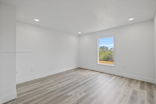 9150 Genesee St, Port Charlotte, FL 33981 - unfurnished room featuring baseboards, recessed lighting, and wood finished floors