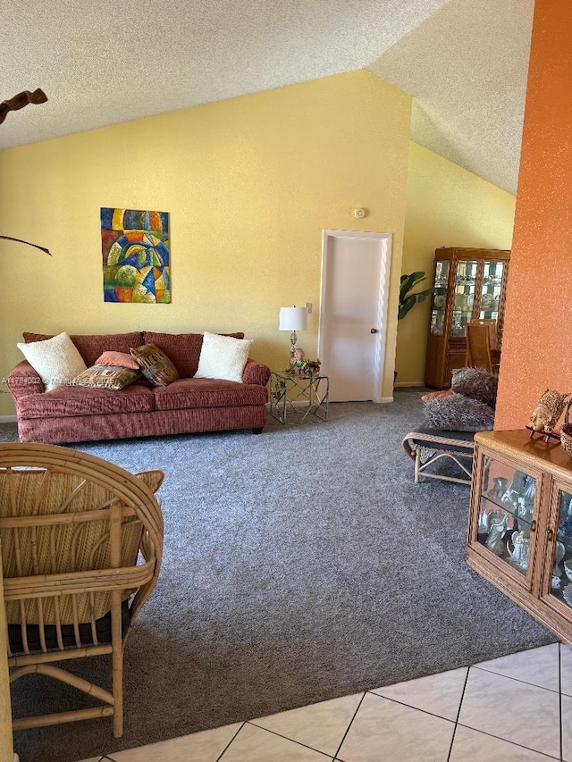 carpeted living area with a textured ceiling and lofted ceiling