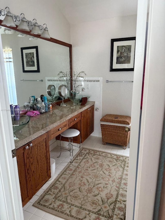 bathroom with tile patterned flooring and vanity