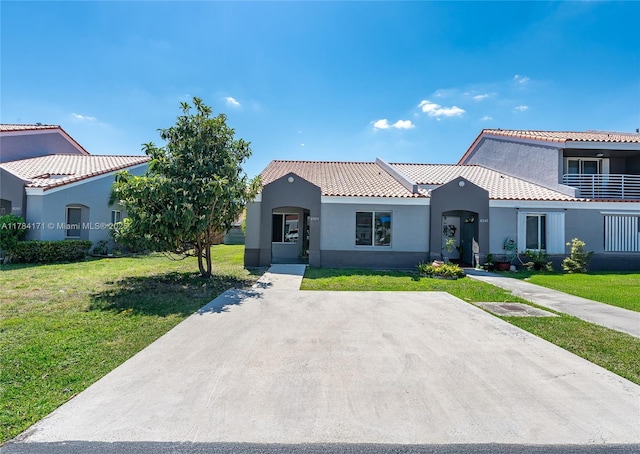 8352 SW 148th Ave, Miami, FL 33193 - mediterranean / spanish house with a front yard, stucco siding, and a tile roof