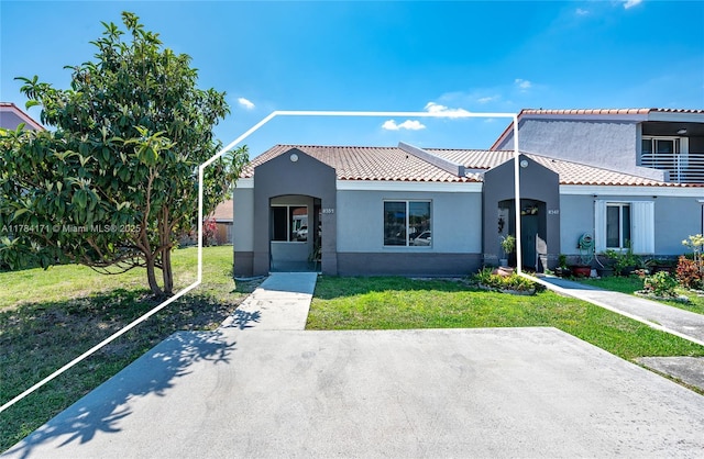 8352 SW 148th Ave, Miami, FL 33193 - mediterranean / spanish house with a tile roof, a front lawn, and stucco siding