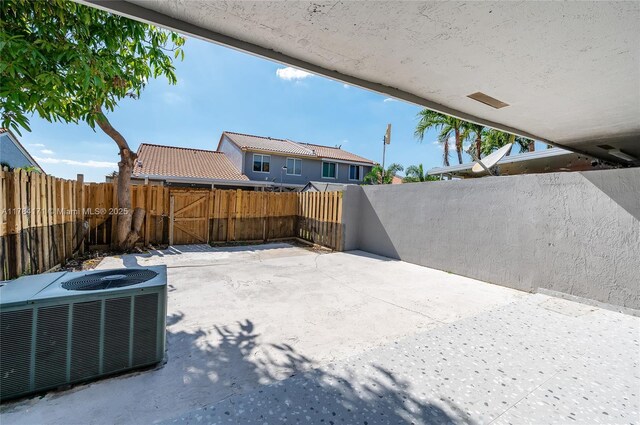 8352 SW 148th Ave, Miami, FL 33193 - view of patio with central AC and a fenced backyard