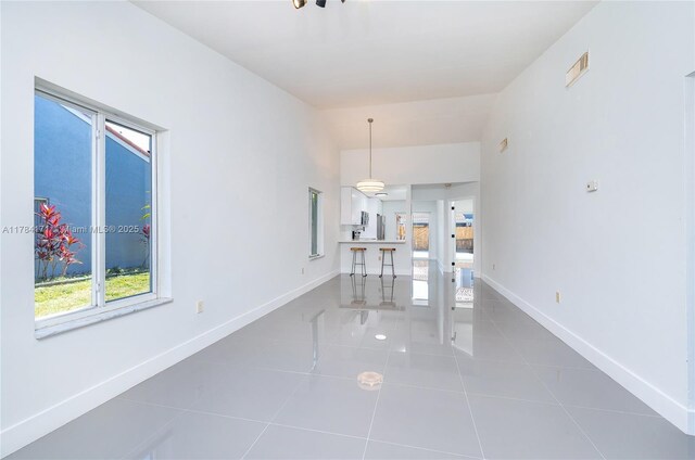 8352 SW 148th Ave, Miami, FL 33193 - tiled dining room featuring plenty of natural light, visible vents, baseboards, and lofted ceiling