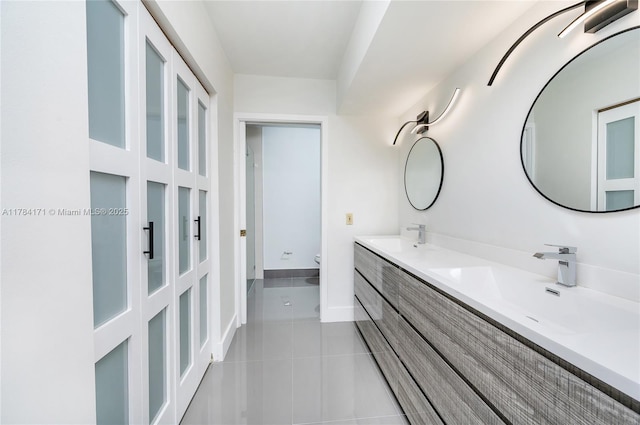 8352 SW 148th Ave, Miami, FL 33193 - bathroom featuring toilet, tile patterned floors, double vanity, and a sink