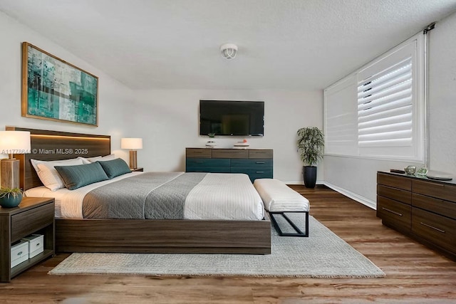 322 Taylor St Unit 1D, Hollywood, FL 33019 - bedroom with wood finished floors and baseboards