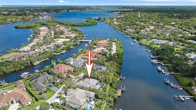 drone / aerial view featuring a water view and a residential view