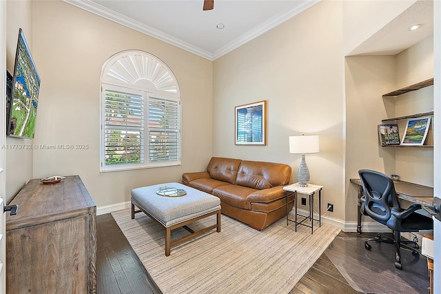 office with ornamental molding, wood-type flooring, baseboards, and ceiling fan