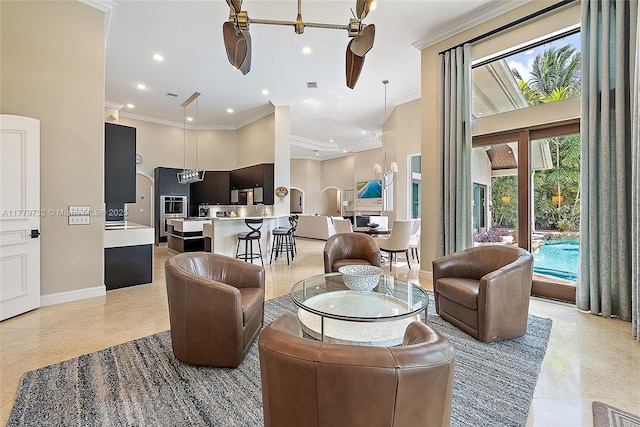 living room featuring crown molding, baseboards, recessed lighting, and a towering ceiling