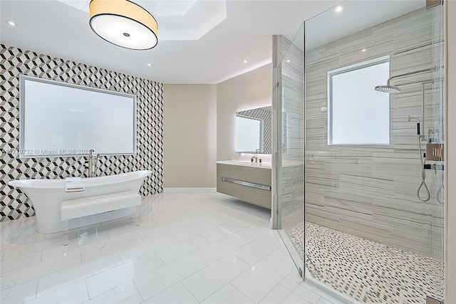 bathroom featuring a shower stall, vanity, recessed lighting, marble finish floor, and a freestanding bath