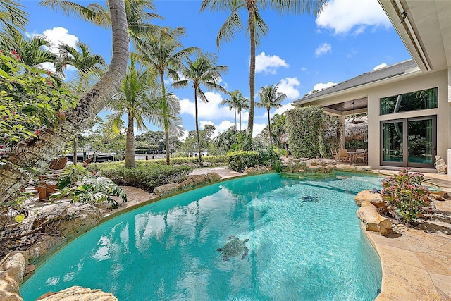 outdoor pool featuring a patio