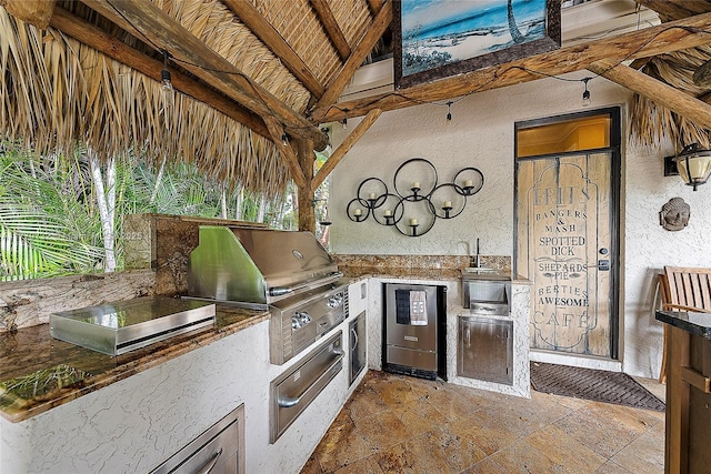 view of patio featuring a grill and exterior kitchen