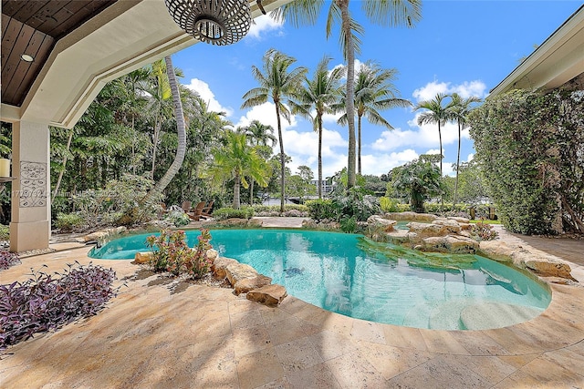 outdoor pool featuring a patio area