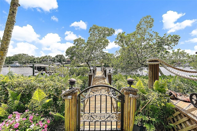 view of gate with a water view