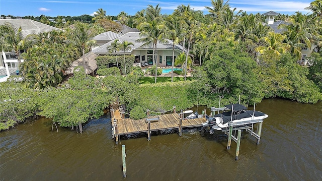 dock area with a water view and boat lift