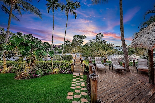 wooden deck with a lawn