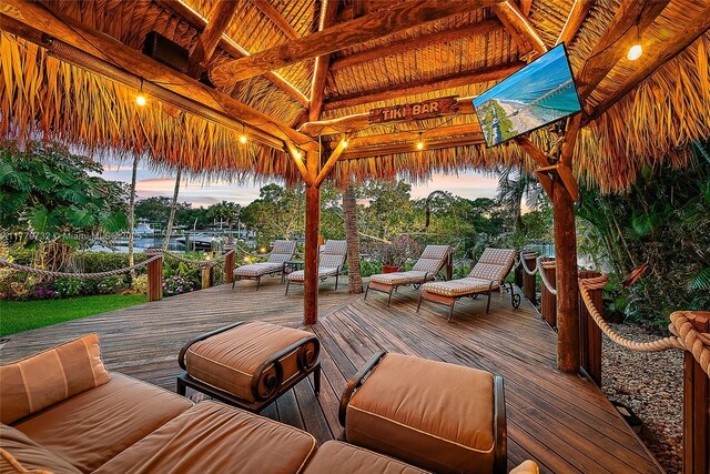 wooden terrace with a gazebo and an outdoor hangout area