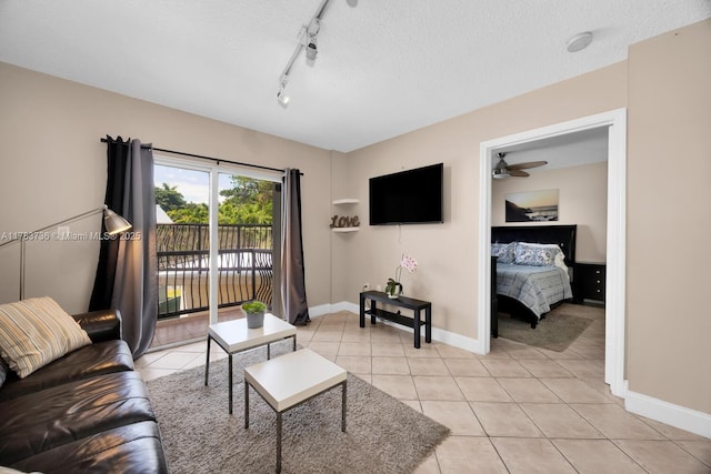 1918 Brickell Ave Unit 204, Miami, FL 33129 - living area with light tile patterned floors, a textured ceiling, baseboards, ceiling fan, and track lighting