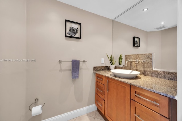 bathroom with visible vents, vanity, baseboards, recessed lighting, and tile patterned floors
