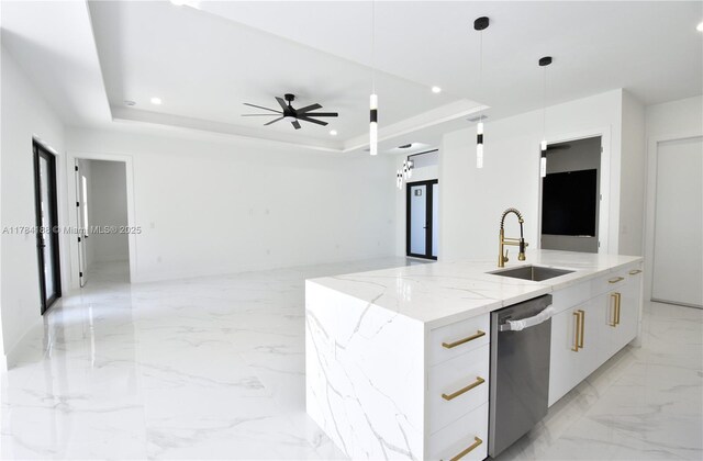 103 Scott Ave, Lehigh Acres, FL 33936 - kitchen featuring modern cabinets, a sink, stainless steel dishwasher, a raised ceiling, and light marble finish floors