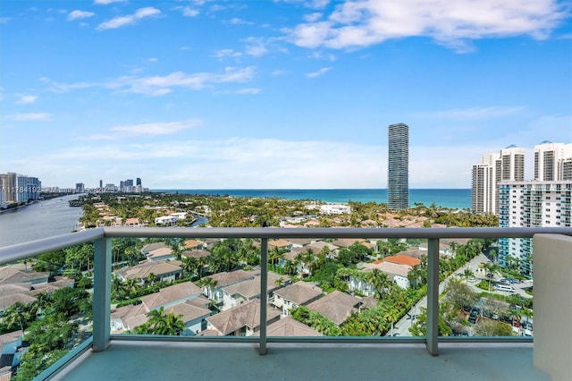 balcony with a view of city and a water view