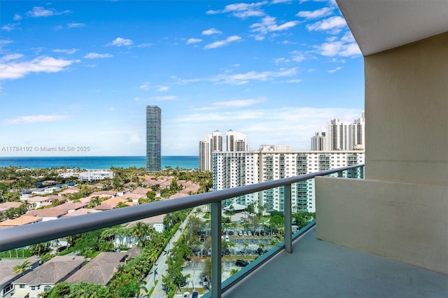 balcony with a view of city and a water view