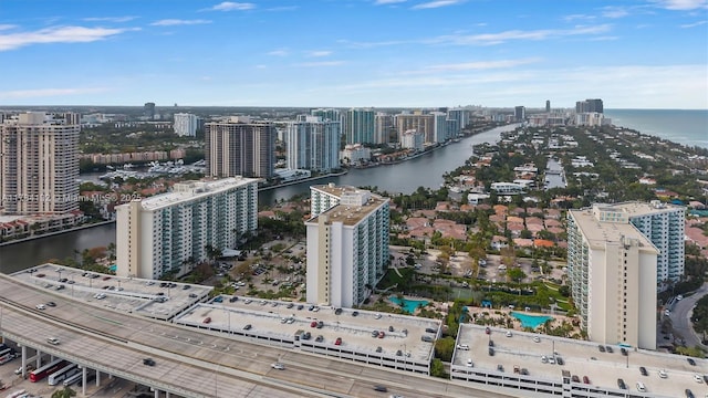 birds eye view of property with a view of city and a water view