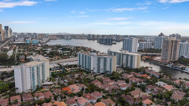 birds eye view of property featuring a view of city and a water view
