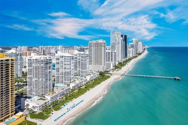 aerial view featuring a view of city, a view of the beach, and a water view