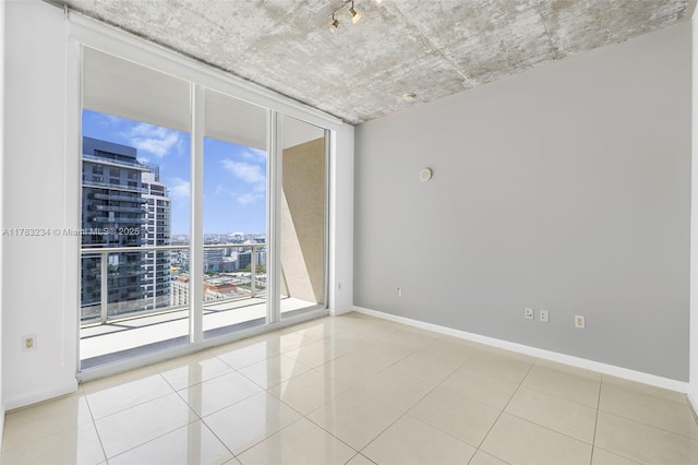 3470 E Coast Ave Unit H2706, Miami, FL 33137 - unfurnished room with a city view, expansive windows, and tile patterned floors