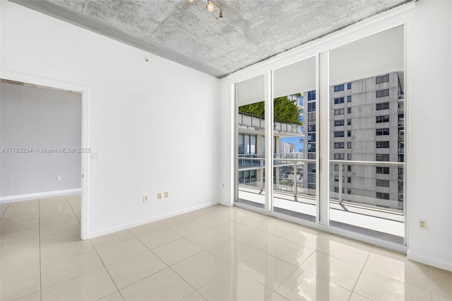 3470 E Coast Ave Unit H2706, Miami, FL 33137 - unfurnished room featuring tile patterned floors, a wall of windows, and a view of city