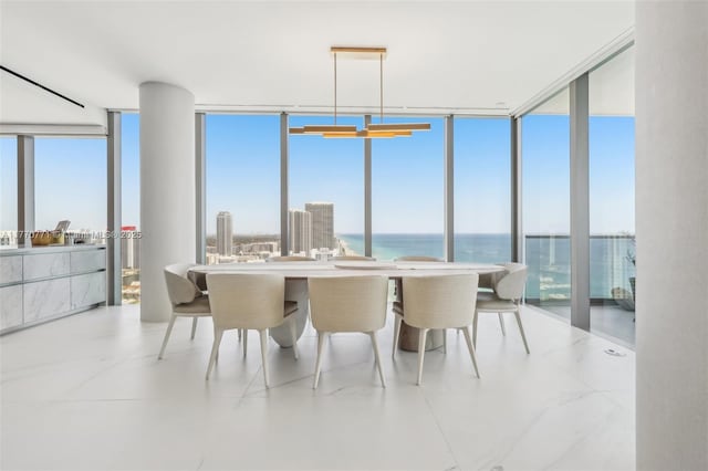 2000 S Ocean Dr Unit 28A, Hallandale Beach, FL 33009 - dining room featuring a wall of windows, a healthy amount of sunlight, and a water view