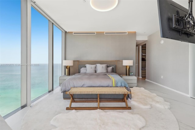 2000 S Ocean Dr Unit 28A, Hallandale Beach, FL 33009 - bedroom with baseboards and a water view