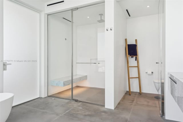 2000 S Ocean Dr Unit 28A, Hallandale Beach, FL 33009 - bathroom with toilet, visible vents, a freestanding tub, concrete floors, and a walk in shower