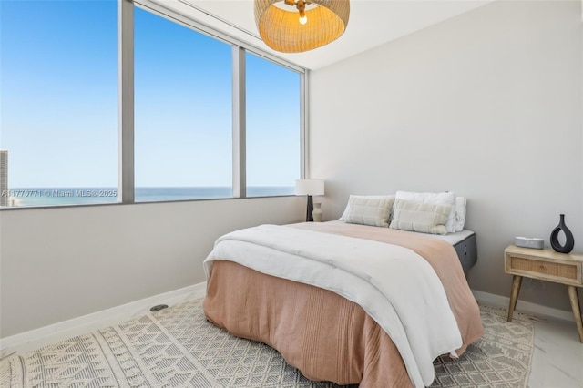 2000 S Ocean Dr Unit 28A, Hallandale Beach, FL 33009 - bedroom featuring a water view and baseboards
