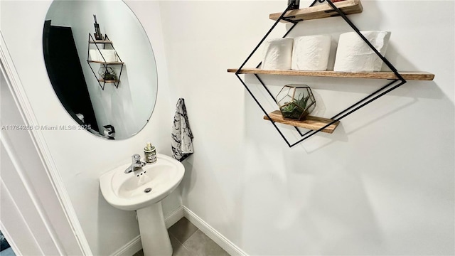 bathroom featuring tile patterned floors and baseboards