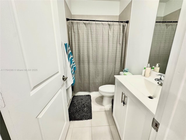 full bathroom featuring tile patterned flooring, vanity, and toilet